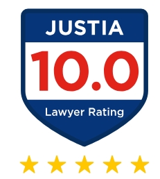 A blue shield with "JUSTIA" at the top, "10.0 Lawyer Rating" in the center, and five yellow stars underneath, indicating a top lawyer rating.